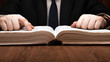 © mizar_21984 - man is looking for information in the dictionary