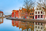 Scenic city view of Bruges canal with beautiful medieval houses, Belgium