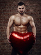 © honored - Young muscular man with heart