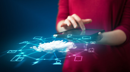 Poster - Close up of hand holding tablet with cloud network technology
