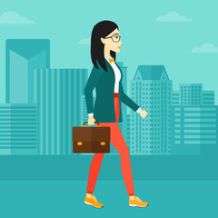 Canvas Print - Business woman walking with briefcase. 