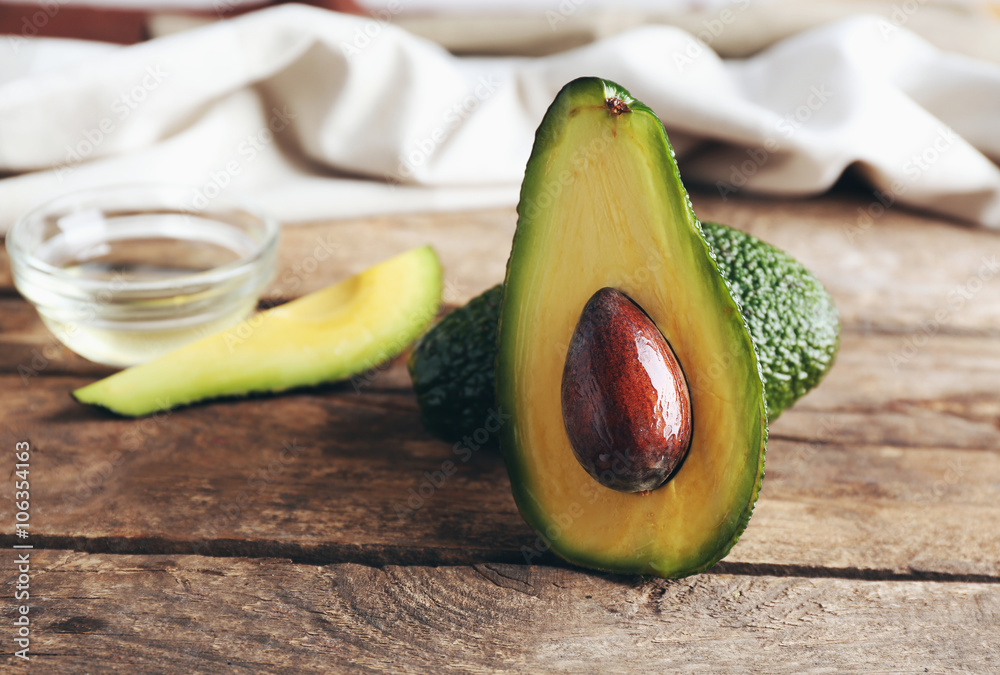 Fresh avocados  on wooden table, close up