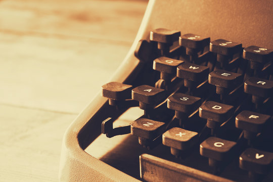 close up image of typewriter keys. vintage filtered. selective focus