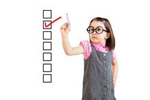 Cute Little Girl Wearing Business Dress And Checking On Checklist Box. White Background.