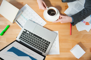 Poster - Cheerful business lady is drinking hot beverage