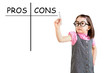 Cute little girl wearing business dress and writing pros and cons comparison concept. White background.
