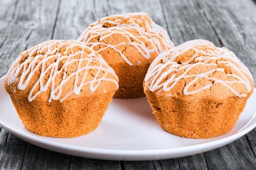 Wall Mural - Whole Wheat muffins with raisins, nuts and ginger, close-up