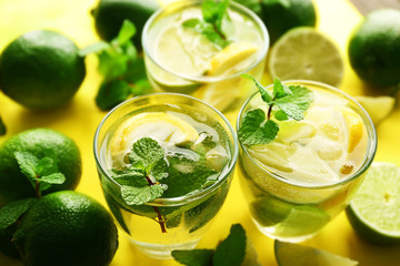 Wall Mural - Mojito drinks with lime, lemon and mint, closeup