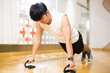 © zhu difeng - young handsome asian man works out in modern gym