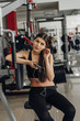 © pro100pasha - Beautiful girl with a phone in the gym