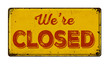 Vintage rusty metal sign on a white background - We are closed