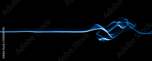 Fotografía Blue line smoke, isolated on black background.