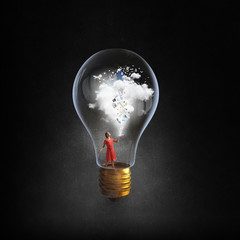 Wall Mural - woman in electric bulb