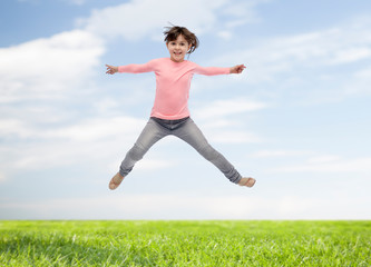 Poster - happy little girl jumping in air