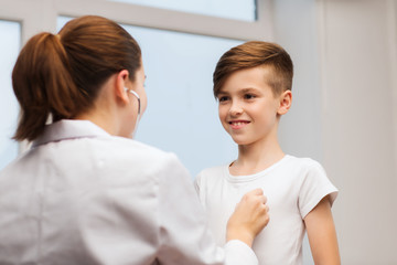 Sticker - doctor with stethoscope listening to happy child