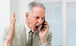 © Minerva Studio - Angry businessman shouting on the phone