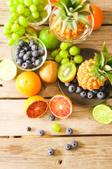  tropical fruit, pineapple, kiwi, red orange and blueberries