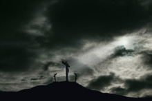 Crucifixion Of Jesus On Golgotha With Darkened Sky And Copy Space