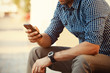 © opolja - Close up of man using mobile smart phone