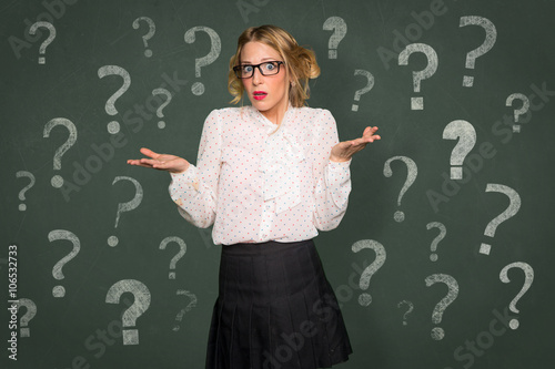 Fotografie, Obraz Conceptual question mark symbol confused baffled overwhelmed helpless woman nerd