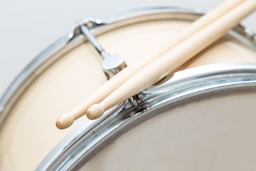 Wood snare drum and drumsticks isolated