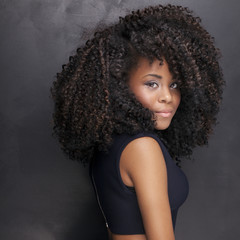 Beautiful african american girl posing in elegant dress.