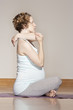© Janet Kimber/Blend Images - Caucasian pregnant woman stretching on yoga mat