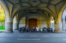 Various Motorcycles Parking Under A Bridge Next To The Urania Buidling In The Swiss City Zurich