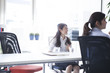 © Monet - Women have a discussion in a bright office