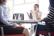 © Monet - Young business woman working in bright office