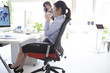 © Monet - Business woman is looking at the map of the world on PC