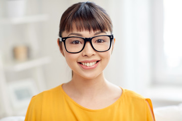 Poster - happy asian young woman in glasses at home