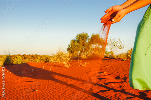 Obraz na PCV pouring sand in the wind sunset at red sand dune on Lasseter Highway near Uluru - Kata Tjuta National Park in Central Australia