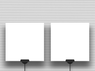 Close-up two square blank frames supported by clips against horizontal grey lines background