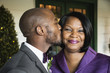 © Roberto Westbrook/Blend Images - Black groom kissing mother at wedding