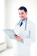 Poster - male doctor writing prescription