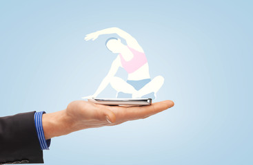 Poster - male hand with smartphone and sportswoman