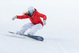 Ssnowboarder on slopes in the sunny morning