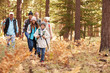 © Monkey Business - Multi generation family hiking in a forest, California, USA