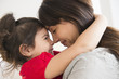 © JGI/Jamie Grill/Blend Images - Hispanic mother and daughter hugging
