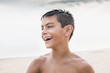 © Sollina Images/Blend Images - Mixed race boy smiling outdoors