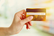 © Africa Studio - Hand holding credit card