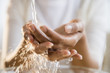 © JGI/Jamie Grill/Blend Images - Mixed race woman washing her hands