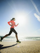 © Erik Isakson/Blend Images - Caucasian woman running on beach