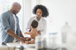 © JGI/Tom Grill/Blend Images - Father and baby at doctor's office