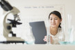 © JGI/Tom Grill/Blend Images - Mixed race teenage girl using laptop computer in science lab