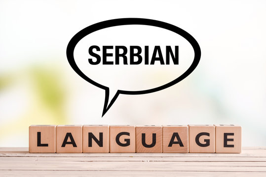 Serbian language lesson sign on a table