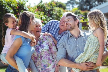 Wall Mural - Family laughing in back yard