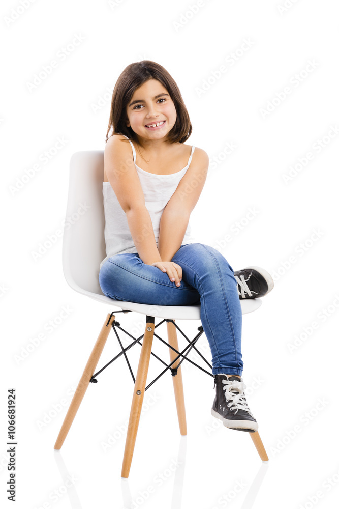 Beautiful young girl sitting on a chair Stock Photo | Adobe Stock