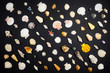 many little sea shells on black background